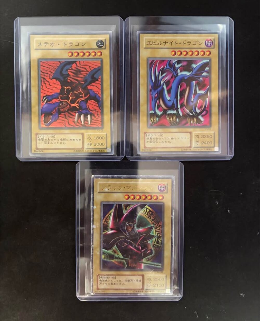 Yu-Gi-Oh! Meteor Dragon, Eviltwin Dragon, and Dark Magician Cards